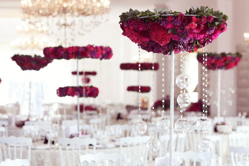 dinner banquet with white tablecloth and flower centerpiece